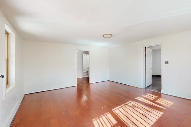 spare room featuring hardwood / wood-style flooring