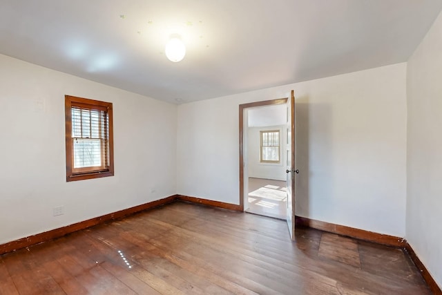 unfurnished room featuring hardwood / wood-style floors