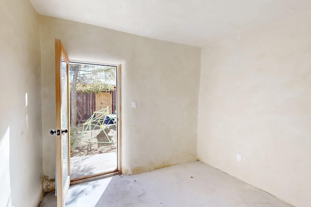 doorway to outside with concrete floors