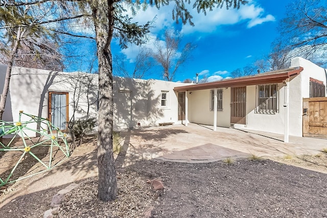 rear view of property with a patio