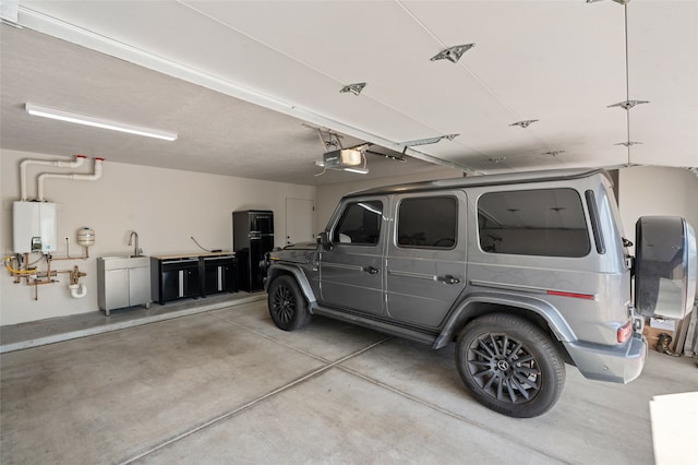 garage featuring a garage door opener and water heater