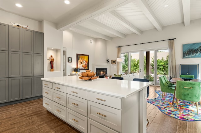 kitchen with dark wood-type flooring, french doors, a kitchen island, and gray cabinetry