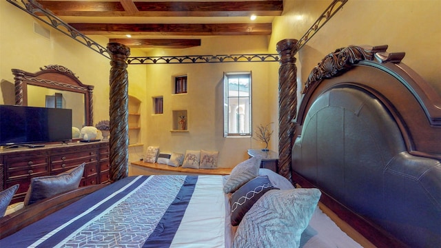 bedroom featuring beamed ceiling