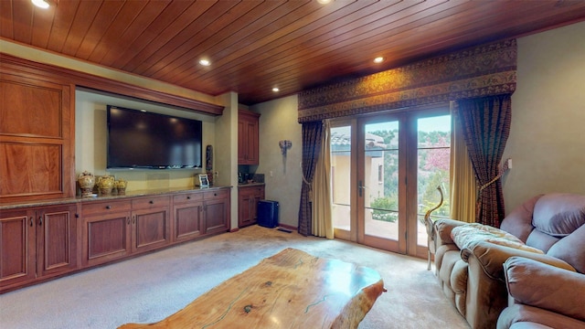 living room with wood ceiling and light colored carpet