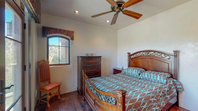 bedroom featuring ceiling fan and dark hardwood / wood-style flooring