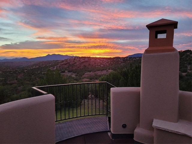 balcony at dusk with a mountain view