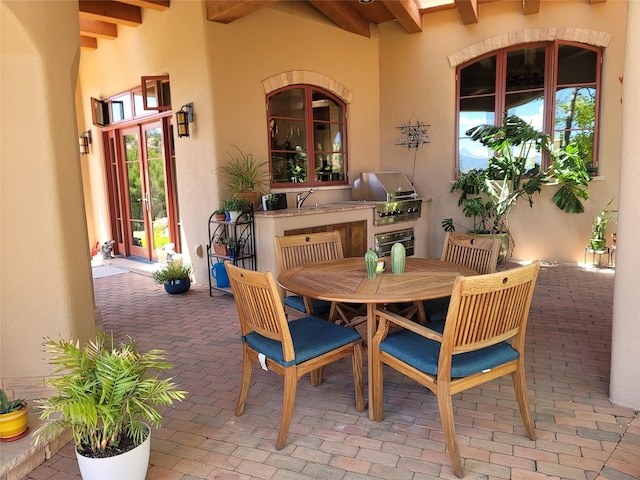 view of patio / terrace with grilling area, sink, and area for grilling