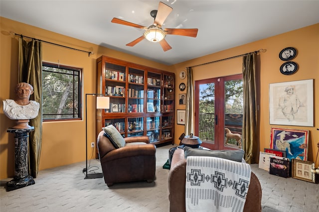 sitting room featuring ceiling fan