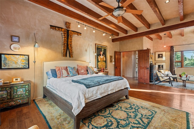 bedroom featuring beamed ceiling, a high ceiling, and dark hardwood / wood-style flooring