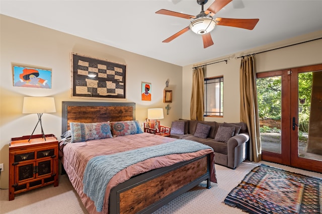 carpeted bedroom with access to exterior, french doors, and ceiling fan