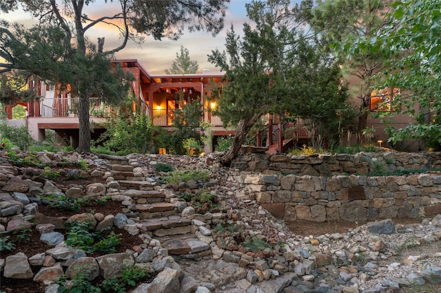 yard at dusk with a deck