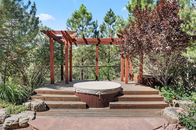 wooden deck featuring a covered hot tub