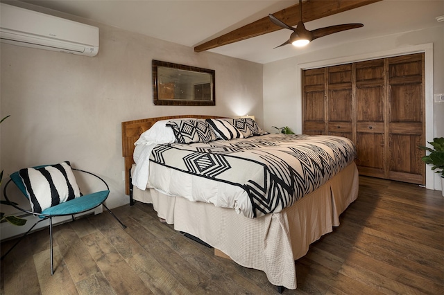 bedroom with ceiling fan, a wall mounted air conditioner, lofted ceiling with beams, dark hardwood / wood-style flooring, and a closet