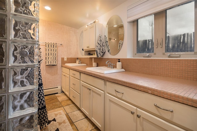 bathroom with vanity and a baseboard heating unit