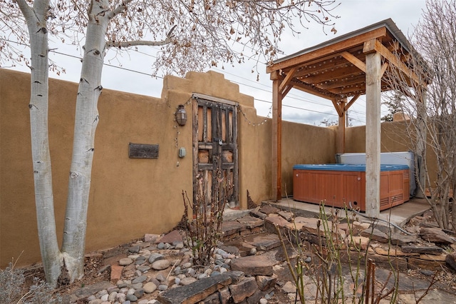 view of patio with a hot tub