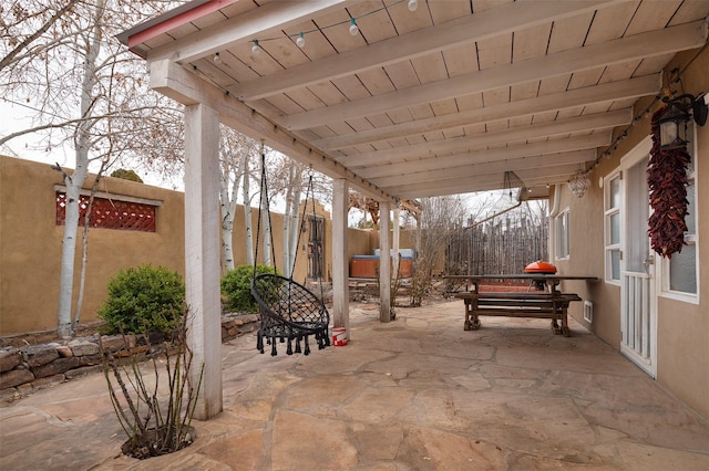 view of patio with a hot tub