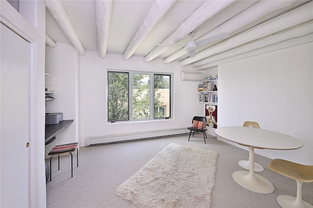 sitting room with baseboard heating, carpet, and beamed ceiling