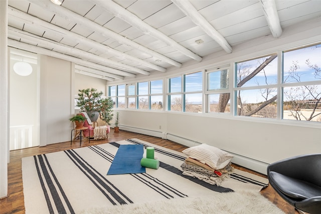 sunroom / solarium featuring beam ceiling and wooden ceiling