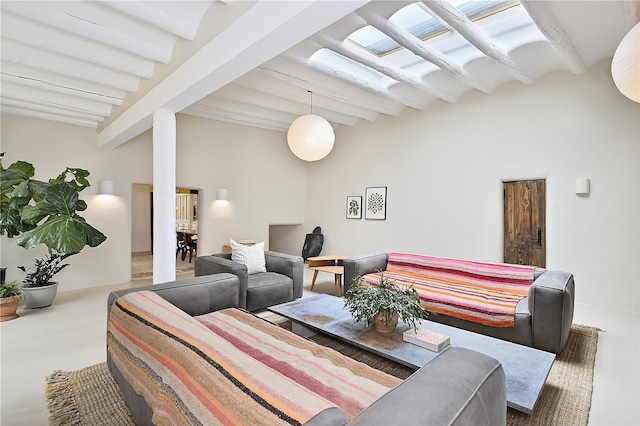 living room featuring lofted ceiling with beams