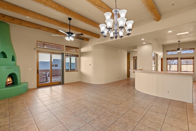 tiled empty room with beamed ceiling and ceiling fan with notable chandelier