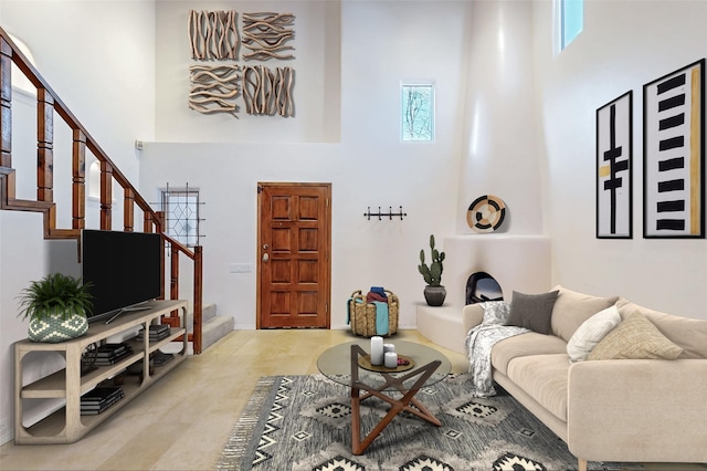 living room featuring a high ceiling