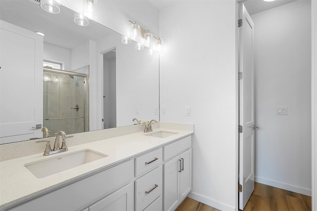 87 Cadena Loop, Los Alamos, NM 87547 - bathroom with a shower stall, double vanity, and wood finished floors