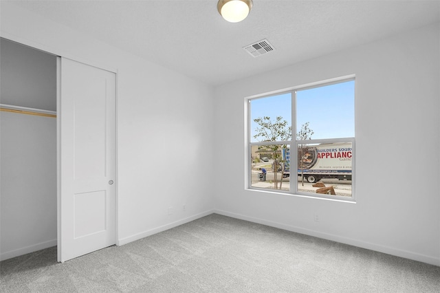 87 Cadena Loop, Los Alamos, NM 87547 - unfurnished bedroom with carpet flooring and a closet