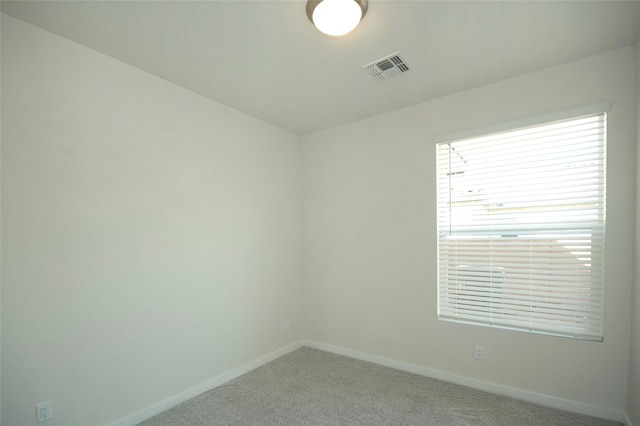 empty room featuring carpet flooring