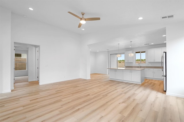87 Cadena Loop, Los Alamos, NM 87547 - unfurnished living room featuring a ceiling fan, light wood-style floors, and recessed lighting