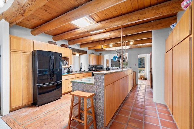 506 Dinkle, Edgewood, NM 87015 - kitchen with black refrigerator, wood ceiling, light brown cabinetry, and decorative light fixtures