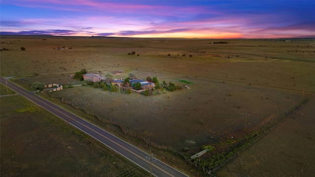 506 Dinkle, Edgewood, NM 87015 - aerial view at dusk featuring a rural view