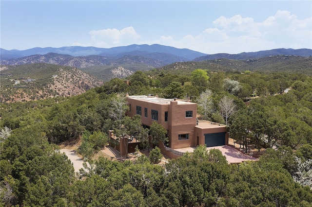 drone / aerial view featuring a mountain view