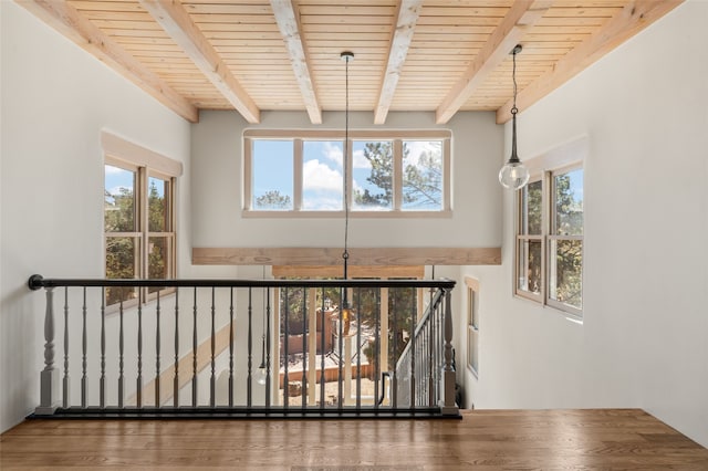 145 Brownell Howland, Santa Fe, NM 87501 - stairs featuring beamed ceiling, plenty of natural light, wooden ceiling, and wood finished floors