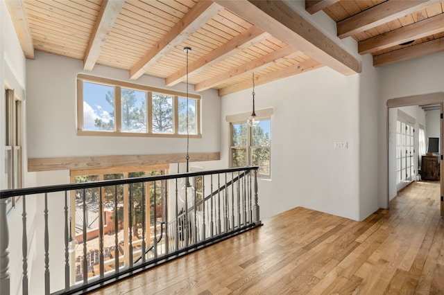 145 Brownell Howland, Santa Fe, NM 87501 - hallway featuring wood ceiling, beam ceiling, wood-type flooring, and an upstairs landing