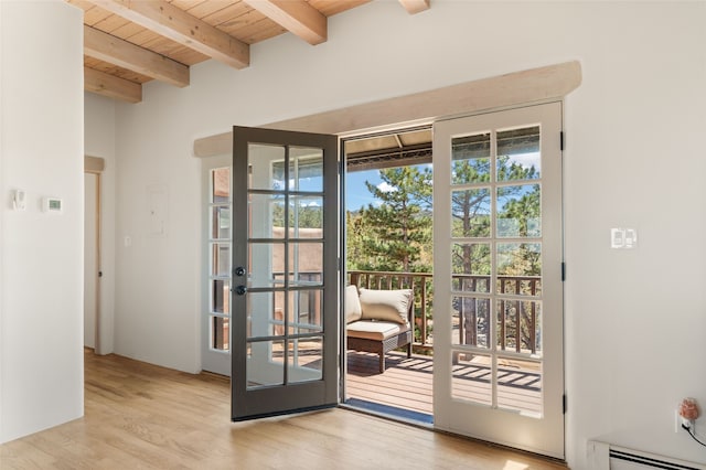 145 Brownell Howland, Santa Fe, NM 87501 - entryway featuring wooden ceiling, french doors, wood finished floors, baseboard heating, and beam ceiling