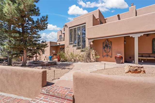 145 Brownell Howland, Santa Fe, NM 87501 - back of property featuring stucco siding