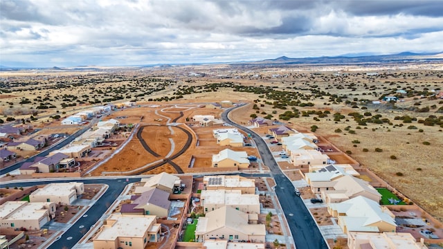 drone / aerial view featuring a mountain view