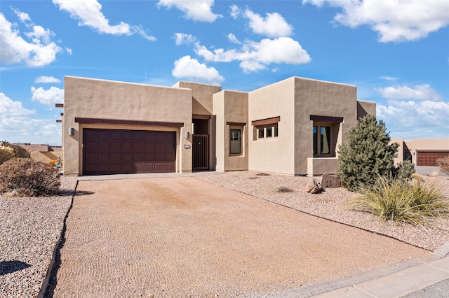 southwest-style home featuring a garage