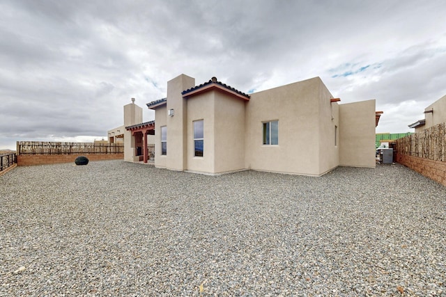 back of property featuring a patio area and cooling unit