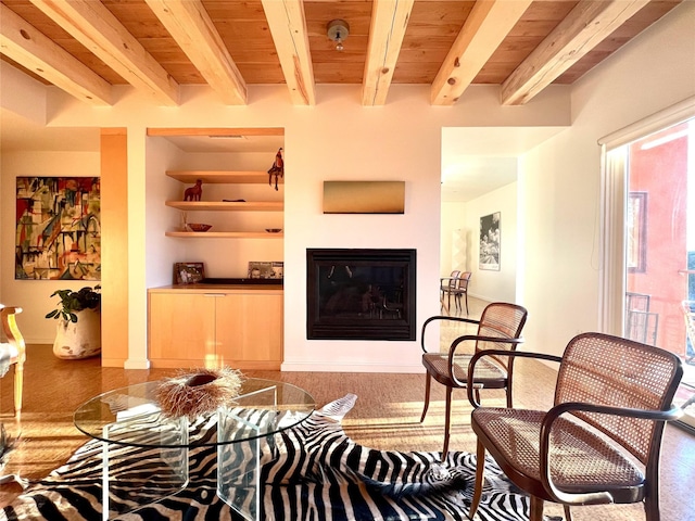 living room with built in features, wooden ceiling, and beam ceiling