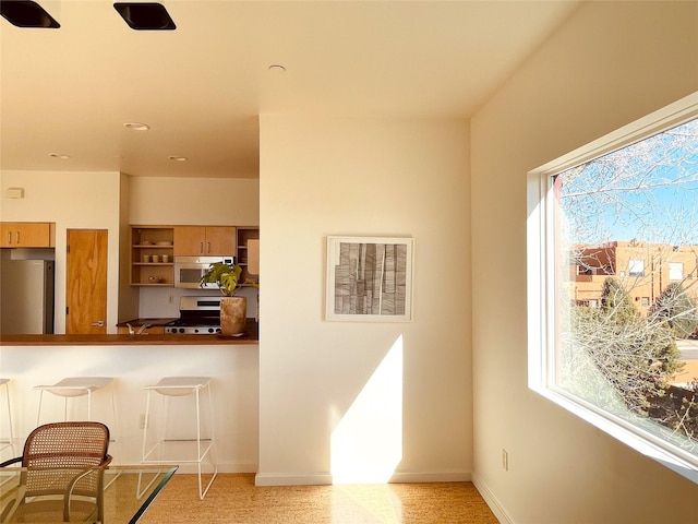 kitchen featuring appliances with stainless steel finishes and plenty of natural light