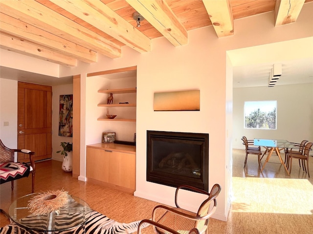 living room with wood ceiling and beam ceiling