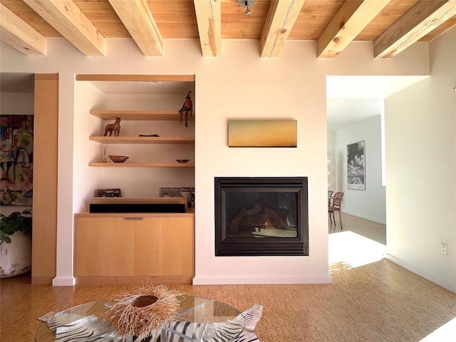 unfurnished living room with beamed ceiling and wood ceiling