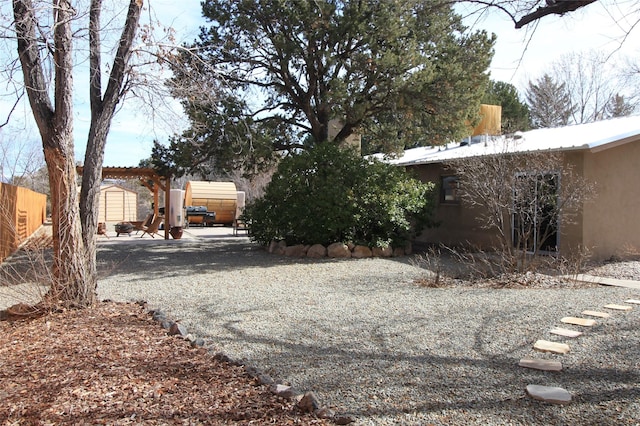 view of yard featuring a storage unit