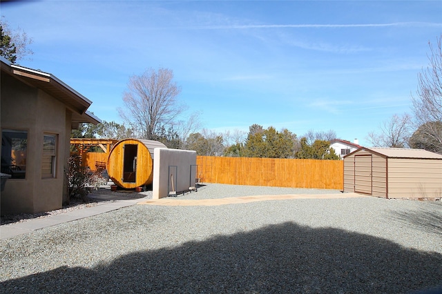 view of yard featuring a storage unit