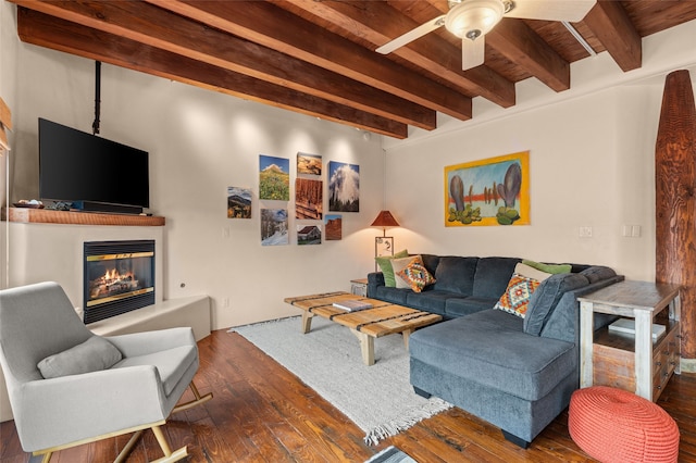 living room with ceiling fan, dark hardwood / wood-style flooring, wooden ceiling, and beam ceiling