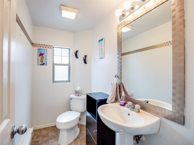 bathroom featuring sink, tile patterned flooring, and toilet