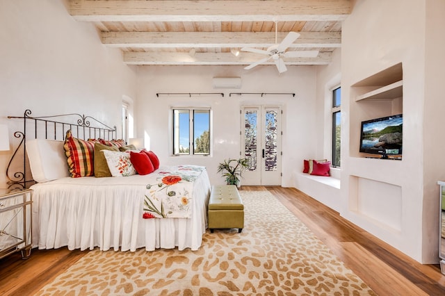 bedroom featuring access to exterior, wood ceiling, multiple windows, and wood finished floors