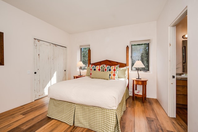 bedroom featuring wood finished floors