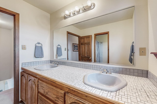 bathroom with a sink and double vanity